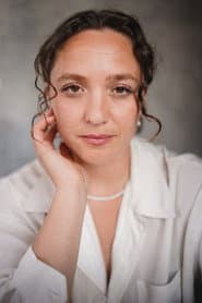 Meg Birley في دور Nurse Roula