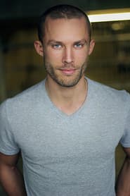 Justin Fortier في دور Hooded Man