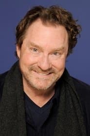 Stephen Root dans le rôle de Fernand Gudge