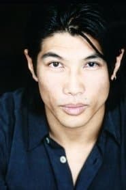 Paul Wu في دور Tow truck driver