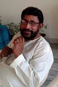 T S Raju as Purushothaman