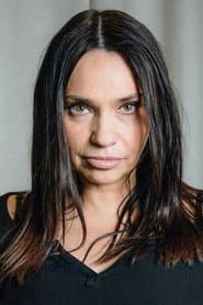 Béatrice Dalle as Café Concert Manager