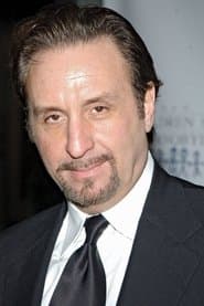 Ron Silver dans le rôle de Frank Traveres