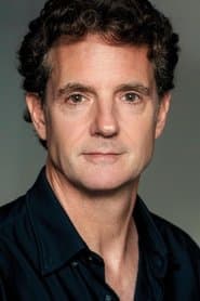 Michael Simon Hall في دور Reporter