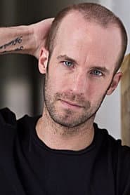 Ash Catherwood في دور State Police Officer