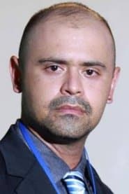 Mike Lucock في دور Adjie