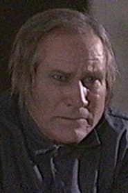Kenneth V. Jones dans le rôle de Caretaker