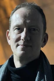 Christophe Cotteret في دور Self - Interviewer / Narrator (voice)