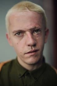 Robert Rhodes في دور Scrawny Prisoner
