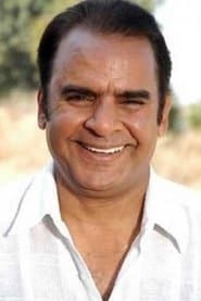 Ravi Jhankal dans le rôle de Puran Kaka