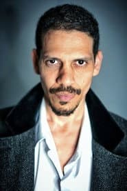 Omalik J. Rosado as Tramp in wheelchair