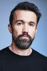 Rob Mac dans le rôle de Elder Harmon