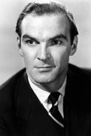 Stanley Baker في دور Tom Yately