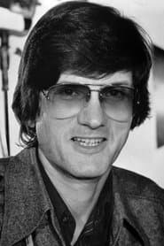 John Badham dans le rôle de Self