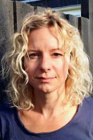 Christine Exner في دور Reporter / Receptionist (voice)