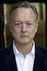 Ian T. Dickinson في دور Interrorgation Officer
