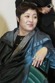 Zhang Qiufang as Zhang Fugui's Wife