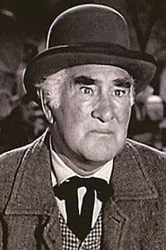 Tudor Owen as Archie Beaton