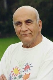 Warren Mitchell dans le rôle de Moss
