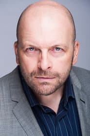 Mark Christopher Collins في دور Trevor Buckland