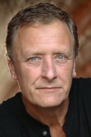 Michael Harding في دور E.V. Benjamin