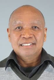 Ivan Abrahams dans le rôle de Dominees Greef