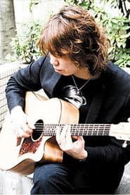 黒田晃年 dans le rôle de Guitar