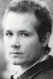 Corbin Allred dans le rôle de Elder Tuttle