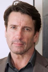 David E. Woodley dans le rôle de William Kelly
