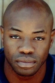 Dayo Ade dans le rôle de Godwin