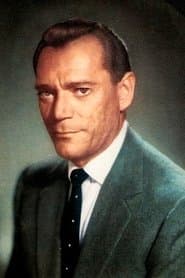 Eddie Constantine في دور Capt. Becaud