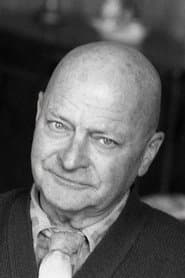 Daniel Boulanger في دور Police Inspector Vital