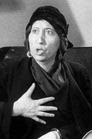 Inez Palange dans le rôle de Mrs. Camonte