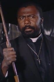 Chico Lourant dans le rôle de Black Pastor