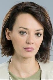 Ana Cristina Oliveira في دور Motel Receptionist