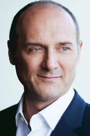 Oliver Becker في دور Brian Clarke