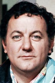 Coluche dans le rôle de The young neighbor / A worker / A cop