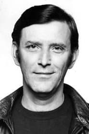 Tom Bell في دور Johnny Deacon