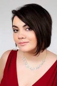 Marissa Lenti في دور Newscaster #1 (voice)