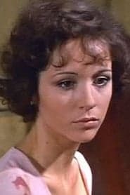 Niké Arrighi as Odile, the Makeup Artist