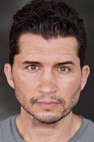 Joey Vieira في دور American News Presenter
