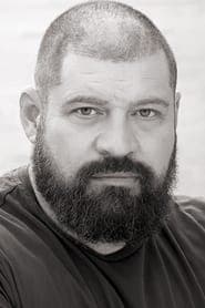 Brad William Henke dans le rôle de Dotson (as Brad Henke)