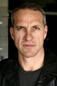 John Reynolds في دور Client X